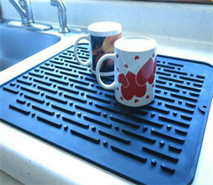 USSE brand silicone dish drying mat with oblong and rounded corner design.